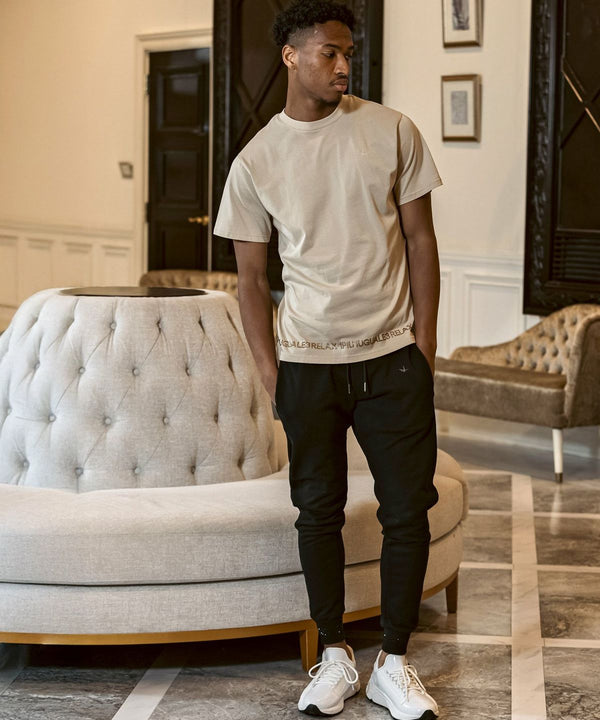 ウノピゥウノウグァーレトレリラックス　ラインストーンヘムスウェットジョガーパンツ