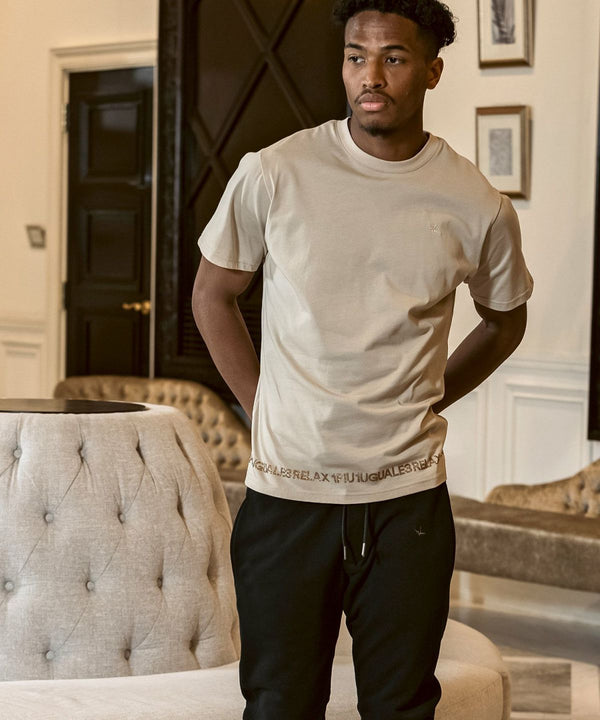 ウノピゥウノウグァーレトレリラックス　ラインストーンヘムスウェットジョガーパンツ