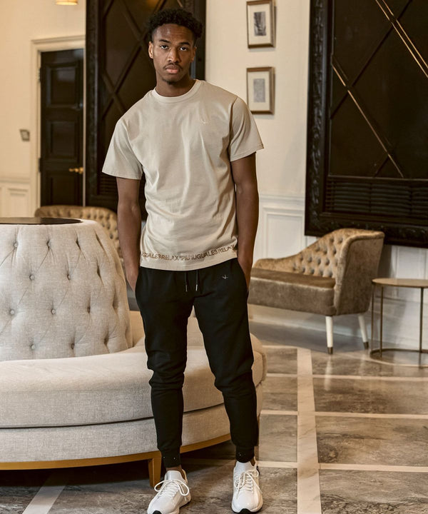 ウノピゥウノウグァーレトレリラックス　ラインストーンヘムスウェットジョガーパンツ