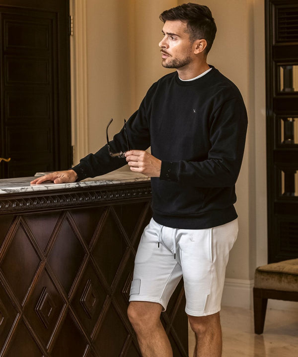 ウノピゥウノウグァーレトレリラックス　ラインストーンカフスウェットクルーネックプルオーバー