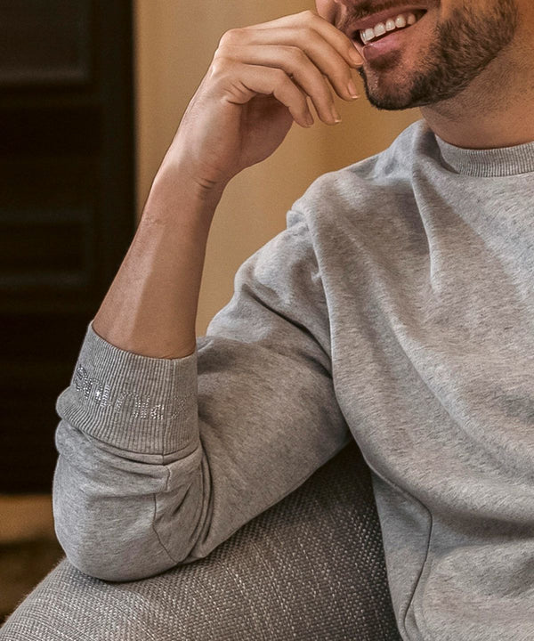 ウノピゥウノウグァーレトレリラックス　ラインストーンカフスウェットクルーネックプルオーバー