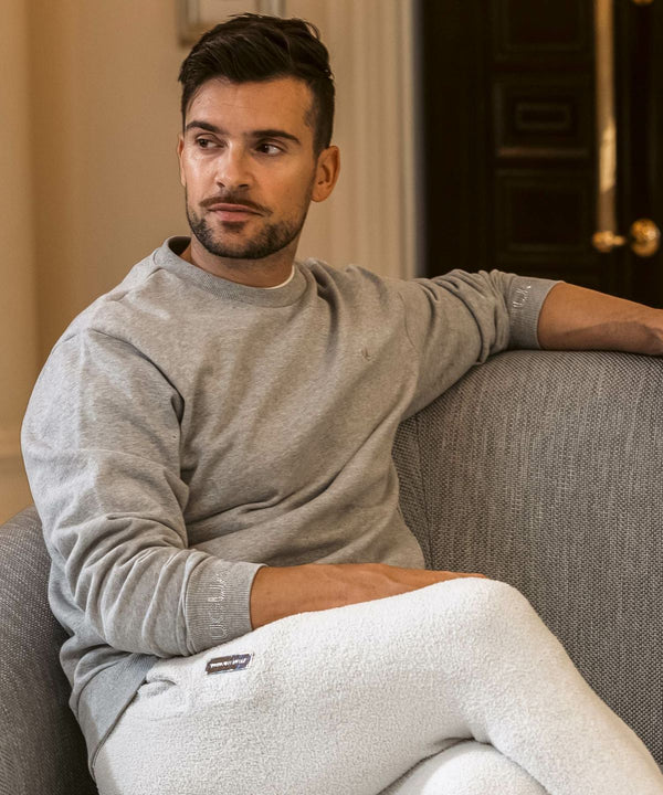 ウノピゥウノウグァーレトレリラックス　ラインストーンカフスウェットクルーネックプルオーバー