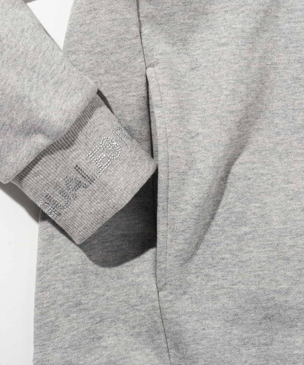 ウノピゥウノウグァーレトレリラックス　ラインストーンカフスウェットクルーネックプルオーバー