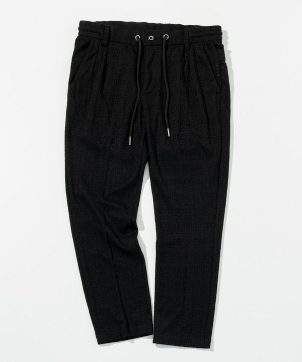 ウノピゥウノウグァーレトレリラックス　ブラックジャガードスラックス