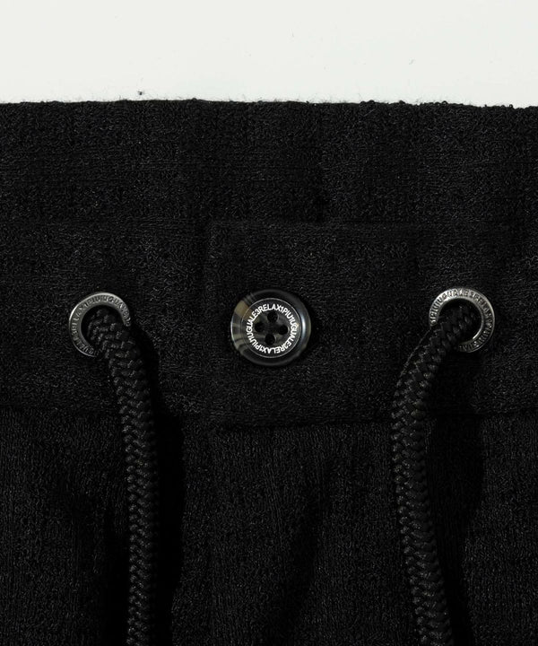 ウノピゥウノウグァーレトレリラックス　ブラックジャガードスラックス