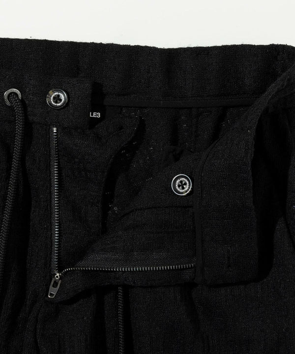 ウノピゥウノウグァーレトレリラックス　ブラックジャガードスラックス